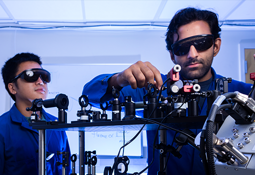 Bolin Liao and Usama Choudhry working on device in lab