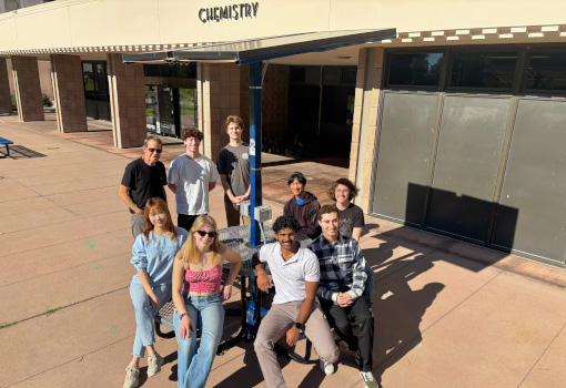 Front row (L to R): Lily Chen, Ava Graef, Arjun Gunda, David Bogdanovic Second row (L to R): Marc Osborn, Camden Smith, Will Morgali, Riley Tang, Michael Krumland-Dunning pictured with solar table